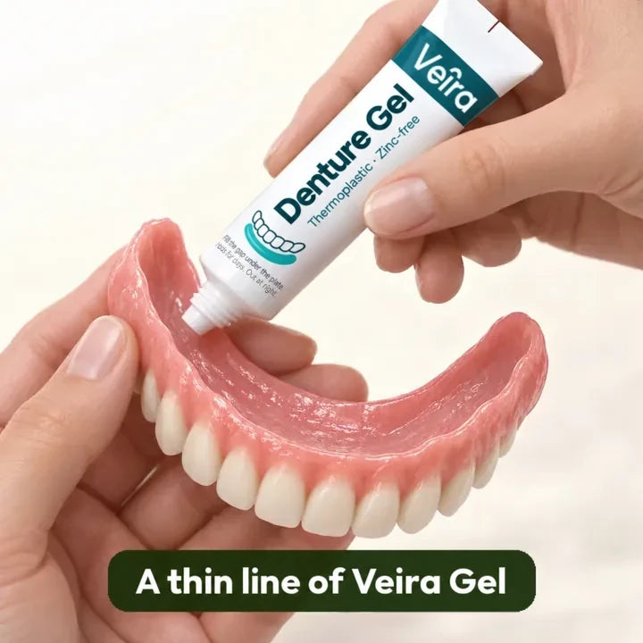 Hands run a thin line of Veira Denture Gel from the tube along the inside of an upper denture. The gel fills the gap and the plate holds; one application holds up to 7 days